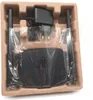 A black router and its power adapter are neatly arranged in a molded pulp packaging tray. Anteprima dell’immagine prodotto