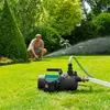 A man is watering his lawn with a garden pump. Produktbild-Vorschau