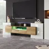 A modern living room with a TV stand and a large television. Voir les images du produit