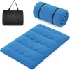 A blue sleeping mat, a rolled-up blue sleeping mat, and a black carrying bag are displayed against a white background. Náhled obrázku produktu