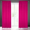 Two pink curtains are hung on a curtain rod in front of a window. Náhľad obrázku produktu