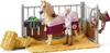 A toy horse and rider set in a stable. Anteprima dell’immagine prodotto