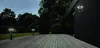 Outdoor deck at dusk with modern wall and bollard lights. Produktbild-Vorschau