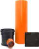 A set of plumbing components including a large orange pipe, a black and orange T-junction pipe fitting, and a black square cover with a circular pattern. Produktbild-Vorschau