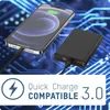 A smartphone is being charged by a power bank, with a background of circuit board patterns. Anteprima dell’immagine prodotto