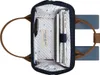An open backpack with items inside. Produktbild-Vorschau