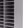 A close-up, partial view of a white or light gray shelving unit. Náhled obrázku produktu