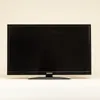 A black Telefunken television set is shown from the front on a light-colored background. Produktbild-Vorschau
