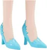 Close-up of two light blue high-heeled shoes on doll legs. Náhľad obrázku produktu