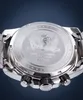 Close-up of the back of a silver watch with black accents. Produktbild-Vorschau