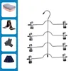 A collage of clothing items and a multi-tiered hanger. Produktbild-Vorschau