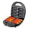 A hot dog maker with hot dogs on skewers in the lower tray and empty molds in the upper tray. Anteprima dell’immagine prodotto