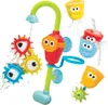 A colorful bath toy set with a water spout and spinning gears. Podgląd zdjęcia produktu