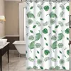 A shower curtain with a leaf pattern in a bathroom. Produktbild-Vorschau