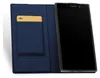 A smartphone in a blue flip case with a card slot. Podgląd zdjęcia produktu