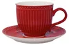 A red teacup and saucer set on a white background. Produktbild-Vorschau