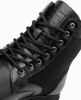Close-up view of the top part of a black boot, focusing on the lacing and material. Produktbild-Vorschau
