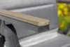 Close-up of an armchair armrest, showing the materials and construction. Produktbild-Vorschau