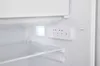 Close-up view of the interior of a white refrigerator, showing a shelf, a light, and a control panel with buttons. Produktbild-Vorschau