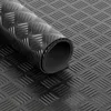 A rolled-up piece of black diamond plate flooring material. Anteprima dell’immagine prodotto
