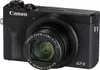 A black Canon PowerShot G7 X Mark III digital camera is shown from a front-facing angle against a white background. Produktbild-Vorschau