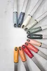 A collection of Microplane graters arranged in a circular pattern on a light gray surface. Anteprima dell’immagine prodotto