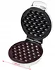 An open waffle maker with dimpled cooking plates for making egg puffs. Náhľad obrázku produktu