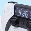A close-up shot of a PlayStation PS5 controller shaped alarm clock. Náhled obrázku produktu