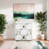 A modern living room scene featuring a white cube shelf unit with decorative items and plants, a large abstract painting on the wall, and a rug on the floor. Náhľad obrázku produktu