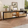 A modern TV stand with a wood grain finish and black accents, decorated with books, a vase of flowers, and framed pictures. Anteprima dell’immagine prodotto