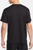 A person wearing a black t-shirt. Podgląd zdjęcia produktu