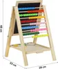 A wooden easel with a blackboard and an abacus, with some accessories on the tray. Voir les images du produit