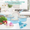 A set of light blue kitchen cookware and utensils is displayed on a countertop with fresh vegetables in the foreground. Náhled obrázku produktu