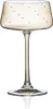 A single champagne coupe glass with gold polka dots. Produktbild-Vorschau