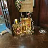 A wedding welcome display with wooden crates, flowers, and fairy lights. Náhled obrázku produktu