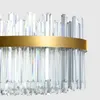 A close-up view of a crystal chandelier with a gold band. Náhľad obrázku produktu