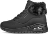 A black Skechers boot with fur trim is shown from the side against a white background. Produktbild-Vorschau