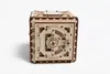 A 3D wooden puzzle in the shape of a safe, presented against a white background. Produktbild-Vorschau