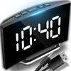 A digital alarm clock with a mirrored LED display showing the time. Produktbild-Vorschau