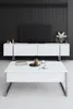 A white TV stand with a TV on top, and a coffee table in front, in a modern living room setting. Anteprima dell’immagine prodotto
