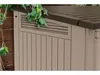 A close-up view of a beige and brown outdoor storage box, with ivy vines draped over the top left corner. Voir les images du produit