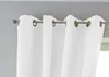 A close-up view of white curtains hanging from a curtain rod. Produktbild-Vorschau