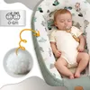 A baby sleeping in a babynest with a close-up of the filling material and a label indicating age suitability. Podgląd zdjęcia produktu