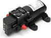 A black water pump with red caps on a white background. Podgląd zdjęcia produktu