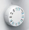 A close-up view of a white rotary dial on a sewing machine, displaying various stitch patterns. Produktbild-Vorschau