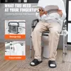 A person sits on a toilet with a walker-style frame around it, reading a magazine. Insets show a storage bag and a tissue holder attached to the frame. Anteprima dell’immagine prodotto