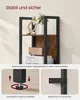 Close-up of a bookshelf with decorative items and a speaker, along with diagrams showing stability features. Produktbild-Vorschau