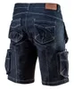 A pair of dark blue denim work shorts with multiple pockets, shown from the back. Produktbild-Vorschau
