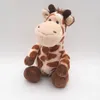 A plush giraffe toy sitting on a white background. Produktbild-Vorschau