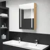 A modern bathroom with a double sink vanity, faucets, and a lighted medicine cabinet. Náhled obrázku produktu